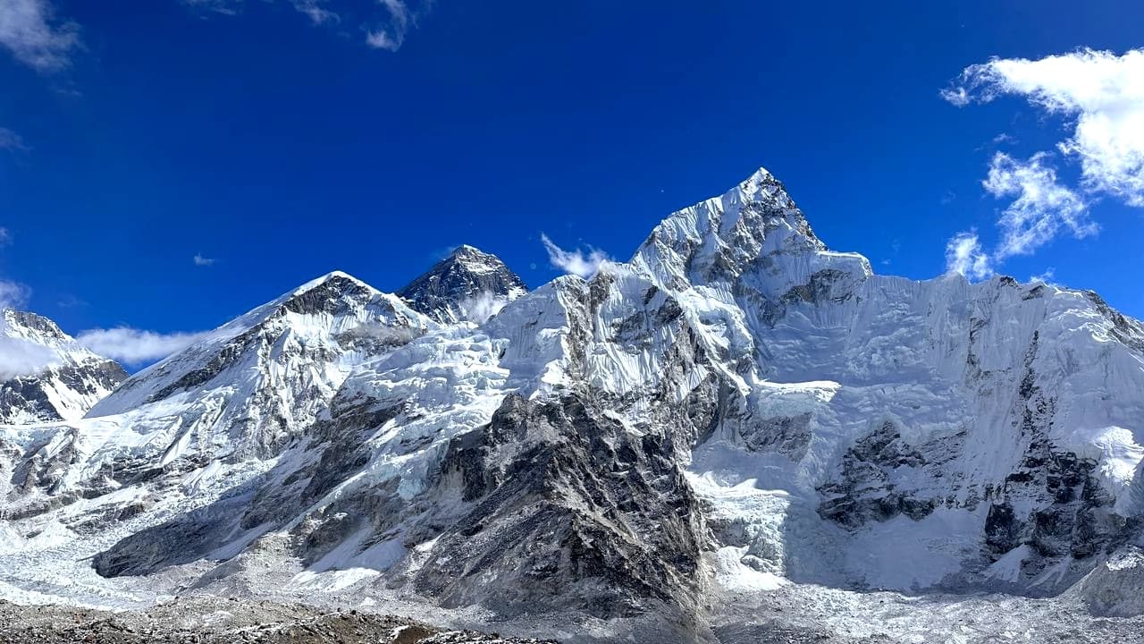 Turquoise view of Gokyo Lake and snowy mountain in the backdrop at Everest region's Three Passes Trek 