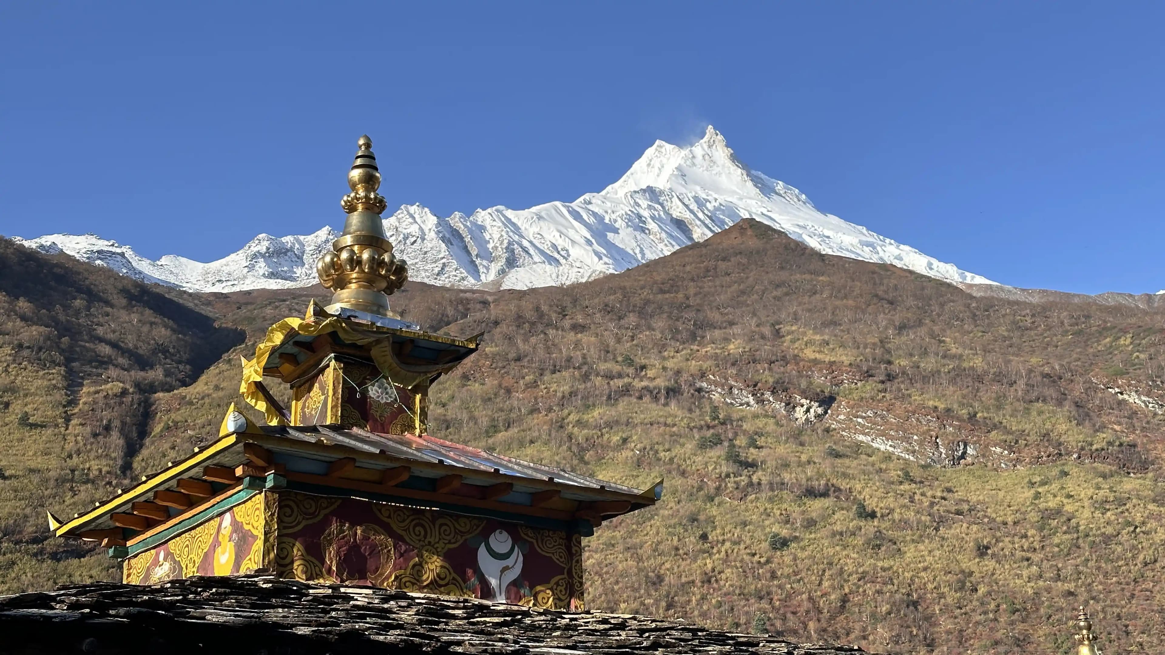 Kyanjin Gompa (monastery) and the mountain peak in the backdrop during Manaslu Circuit Trek